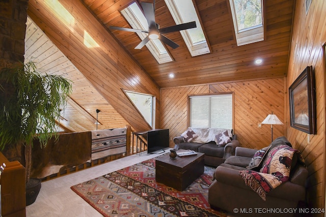 living room featuring wood walls, a wealth of natural light, wooden ceiling, and high vaulted ceiling