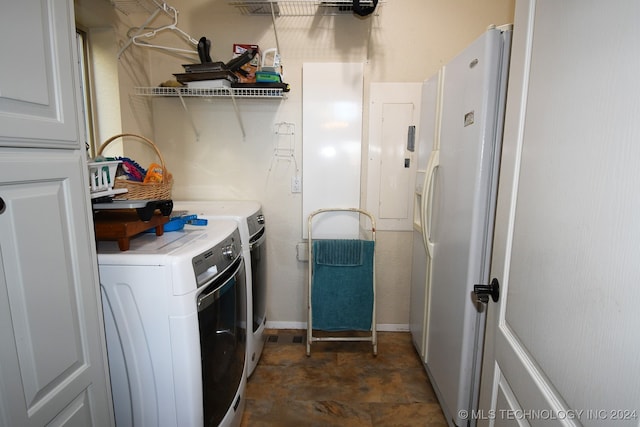 clothes washing area with electric panel and separate washer and dryer