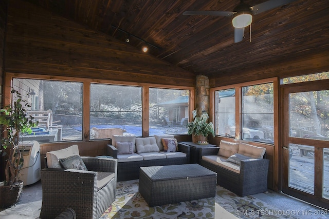 sunroom / solarium featuring wood ceiling, ceiling fan, and vaulted ceiling