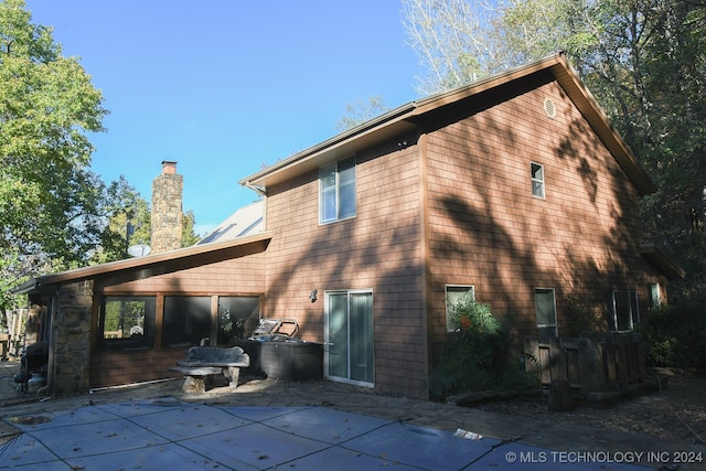 rear view of house featuring a patio