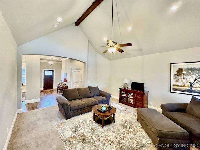 living room with beamed ceiling, wood-type flooring, ceiling fan, and high vaulted ceiling