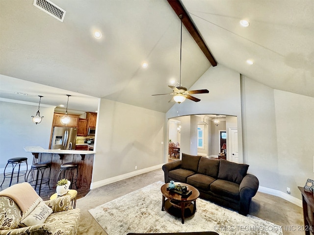 carpeted living room with beamed ceiling, ceiling fan, and high vaulted ceiling