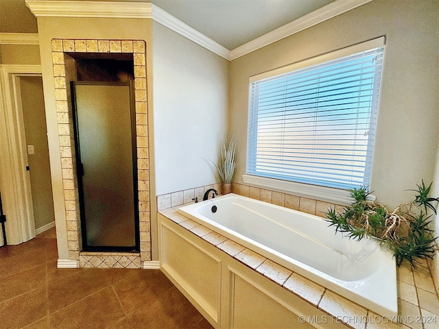 bathroom featuring tile patterned flooring, ornamental molding, and separate shower and tub