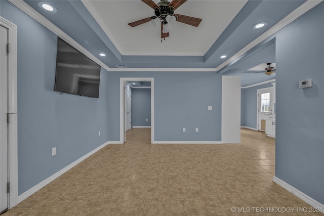 tiled empty room with ceiling fan and crown molding