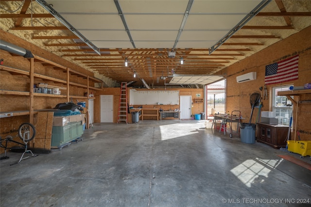 garage with a wall mounted air conditioner