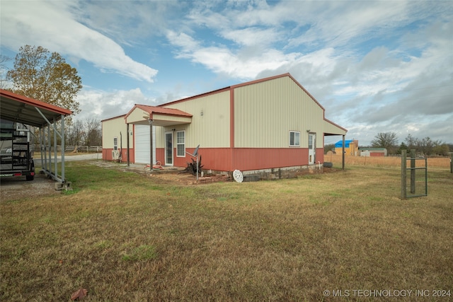 view of side of property with a lawn