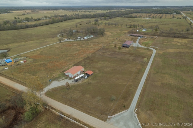 birds eye view of property with a rural view