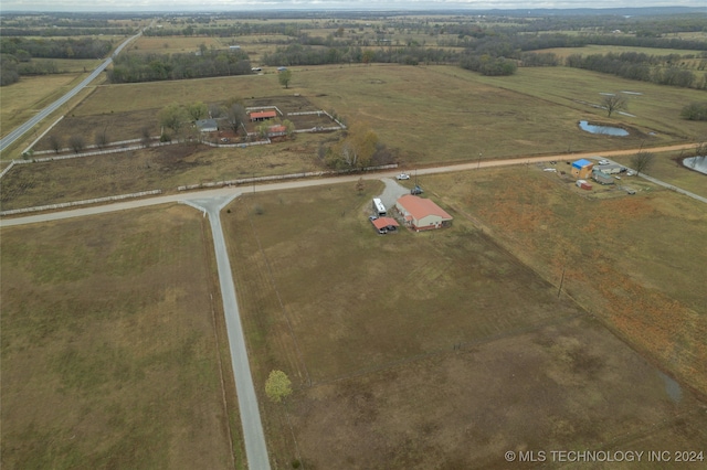 birds eye view of property featuring a rural view