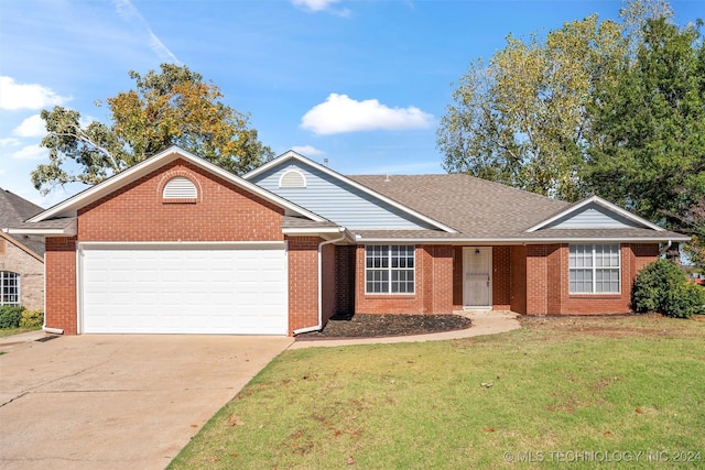 ranch-style home with a garage and a front yard