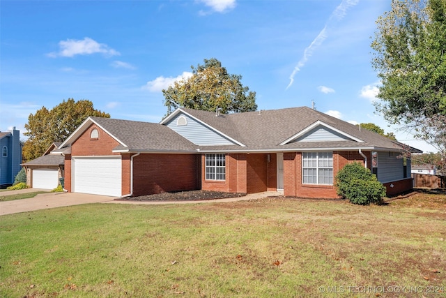 ranch-style home with a garage and a front yard