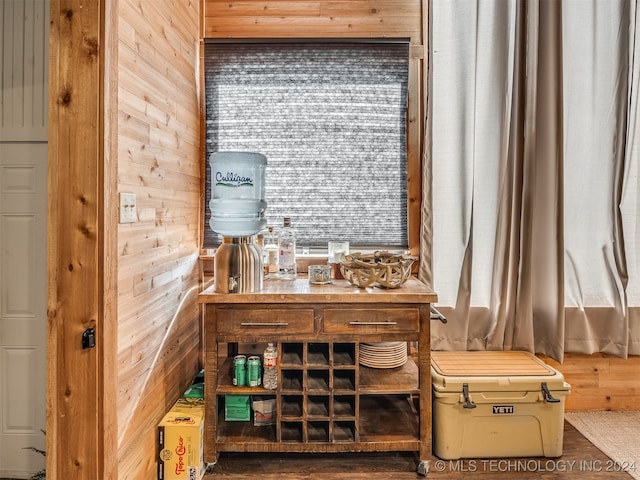 interior space featuring wood walls and hardwood / wood-style flooring