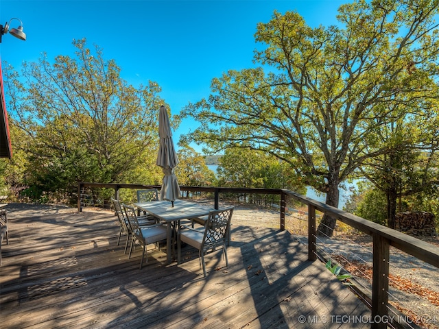 wooden deck featuring outdoor dining space