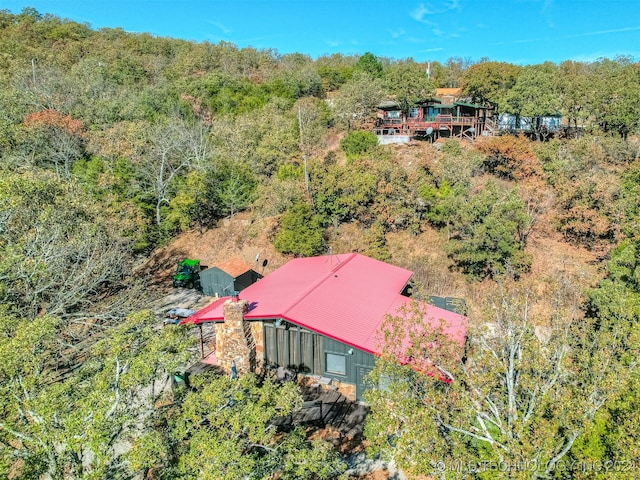 aerial view with a wooded view