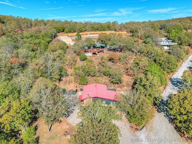 bird's eye view featuring a wooded view