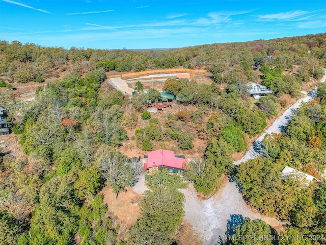 bird's eye view featuring a wooded view