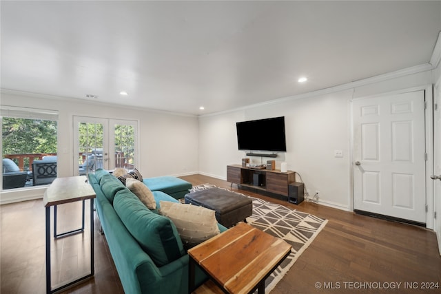 living room with dark hardwood / wood-style floors, crown molding, and french doors