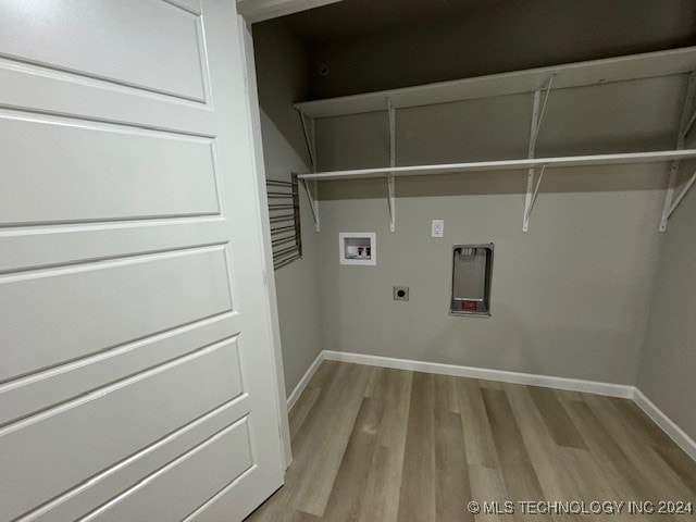 clothes washing area featuring light wood-type flooring, electric dryer hookup, and hookup for a washing machine