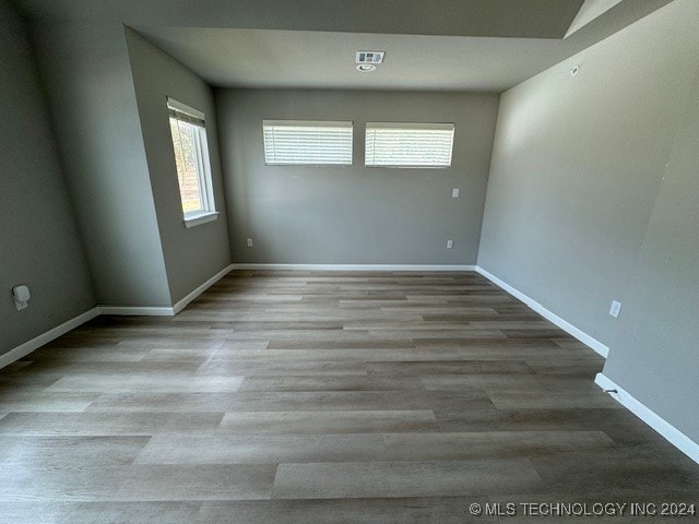 spare room featuring light hardwood / wood-style floors