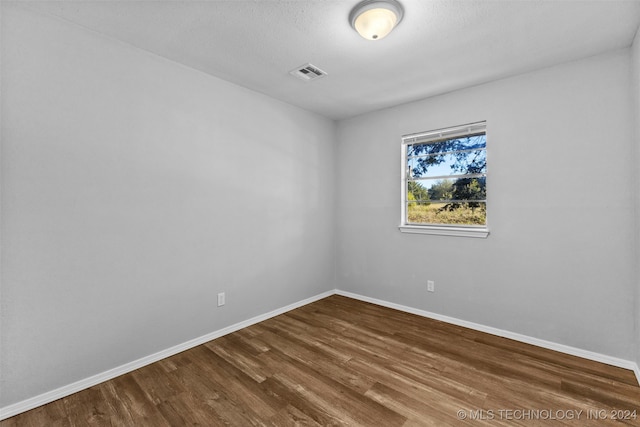 empty room featuring hardwood / wood-style floors