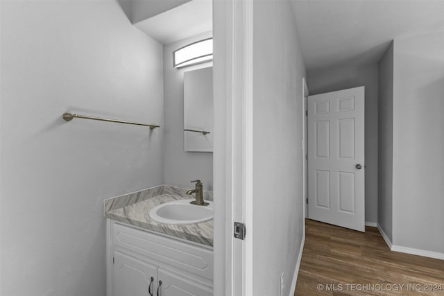 bathroom featuring vanity and hardwood / wood-style floors