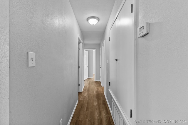 hall featuring dark hardwood / wood-style floors