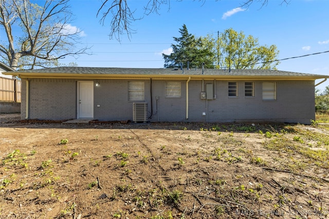 back of property featuring central air condition unit