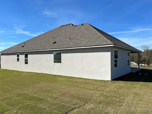 view of home's exterior featuring a yard