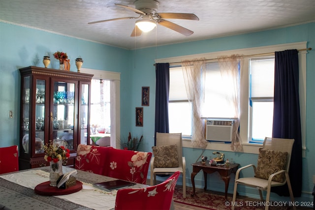 dining room featuring ceiling fan, a healthy amount of sunlight, and cooling unit