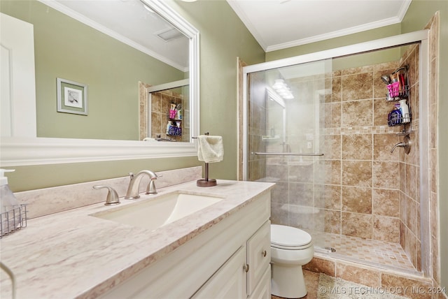 bathroom with a shower with door, vanity, and crown molding