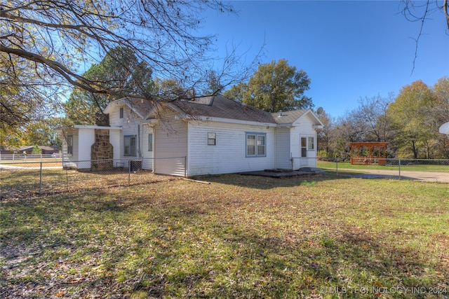 view of property exterior featuring a yard