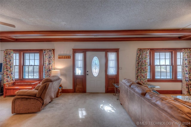 15705 Old Morris Hwy, Okmulgee, OK 74447 - entryway featuring healthy amount of natural light, a textured ceiling, and carpet floors