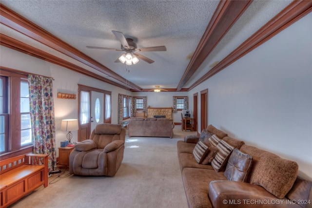 15705 Old Morris Hwy, Okmulgee, OK 74447 - living area featuring light carpet, ceiling fan, a stone fireplace, a textured ceiling, and ornamental molding