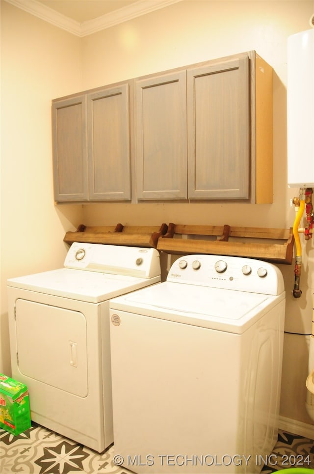 laundry area with cabinets, separate washer and dryer, and ornamental molding