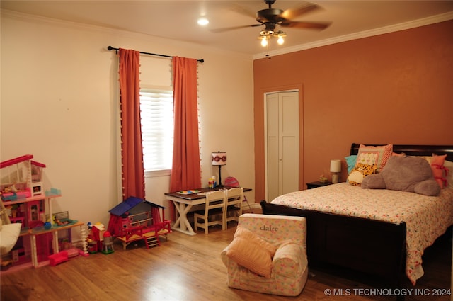 bedroom featuring ornamental molding, ceiling fan, and light hardwood / wood-style flooring