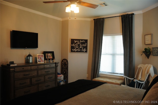 bedroom featuring ceiling fan and crown molding