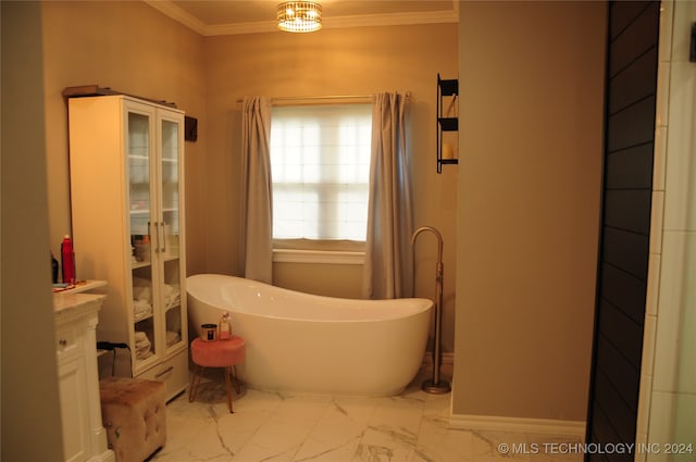 bathroom with a tub, vanity, and crown molding