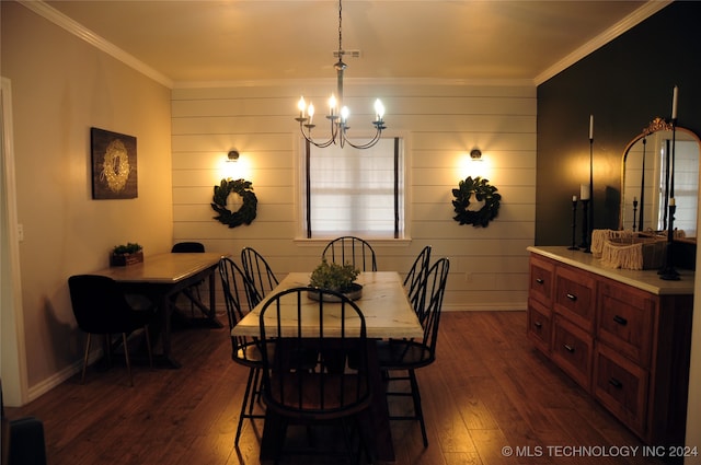 dining room featuring wood walls, dark hardwood / wood-style floors, a chandelier, and crown molding