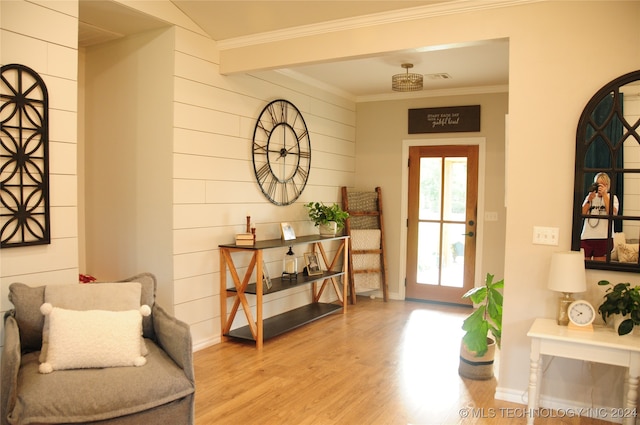 interior space featuring light hardwood / wood-style floors and crown molding