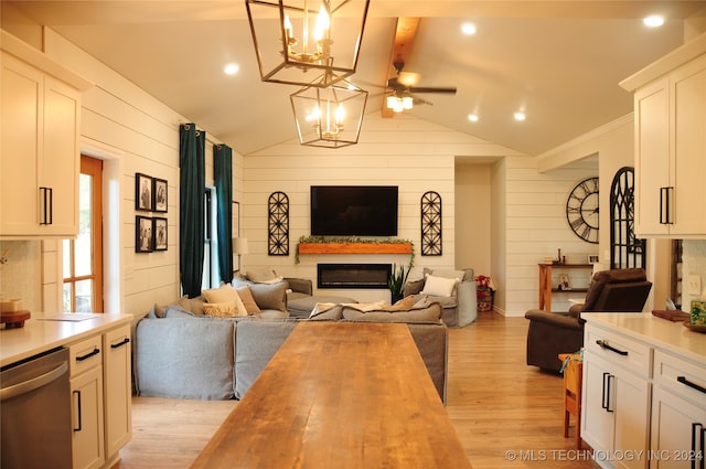 living room with wood walls, ceiling fan, light wood-type flooring, and lofted ceiling with beams