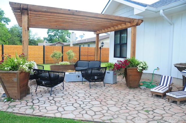 view of patio with outdoor lounge area and a pergola