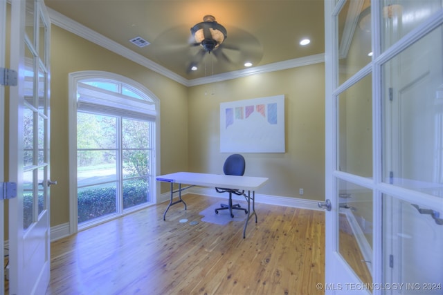 office space with french doors, light hardwood / wood-style flooring, ceiling fan, and crown molding