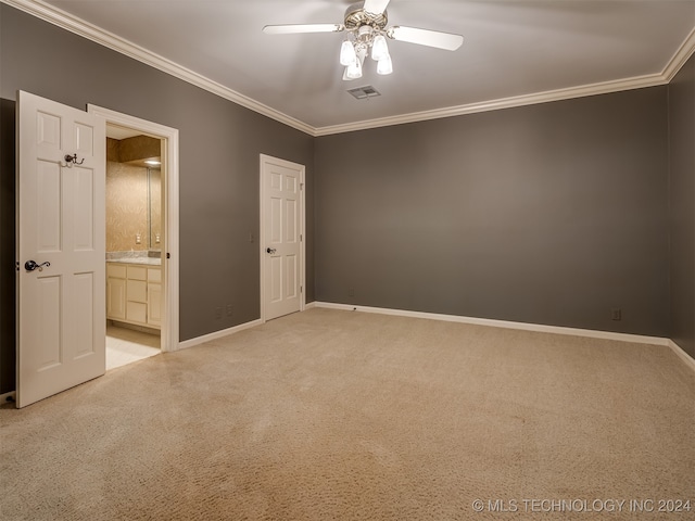 unfurnished bedroom featuring ceiling fan, ornamental molding, light carpet, and connected bathroom