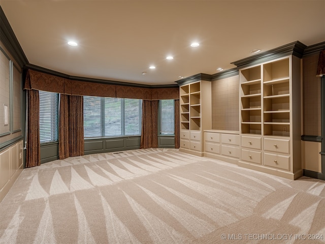 unfurnished bedroom featuring crown molding and light colored carpet