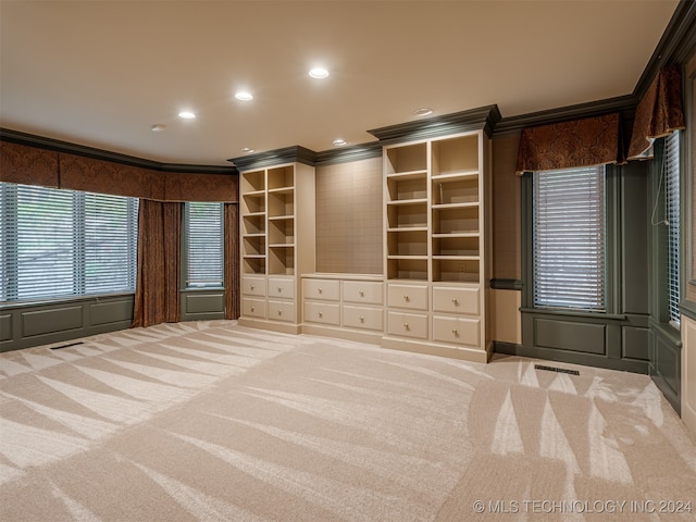 unfurnished bedroom featuring light carpet and ornamental molding