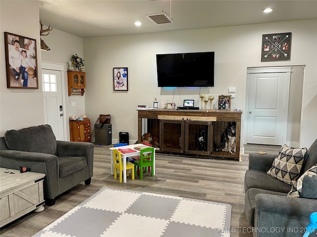 living room with light hardwood / wood-style flooring