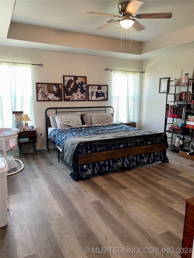 bedroom featuring hardwood / wood-style flooring and ceiling fan