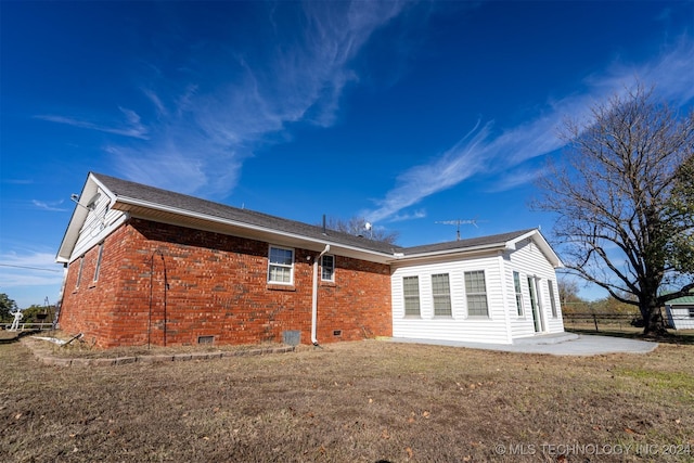 815 S Oak Grove Rd, Cushing, OK 74023 - rear view of house with crawl space, brick siding, and a patio