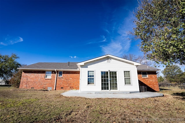 815 S Oak Grove Rd, Cushing, OK 74023 - rear view of property featuring brick siding, a patio area, crawl space, and roof with shingles