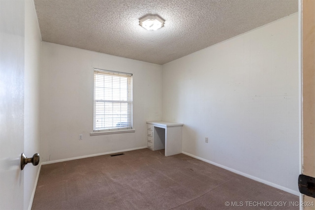 815 S Oak Grove Rd, Cushing, OK 74023 - carpeted empty room with a textured ceiling and baseboards
