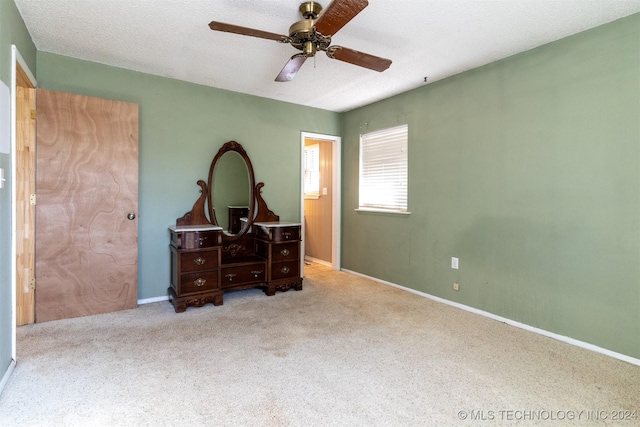 815 S Oak Grove Rd, Cushing, OK 74023 - carpeted bedroom featuring ceiling fan and a textured ceiling